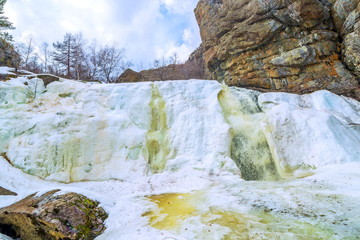 Beautiful frozen gadelsha waterfall in the southern Urals in the Republic of Bashkortostan on a...