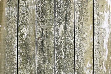 Old, weathered wooden wall. Peeling paint plank texture. Floor made with desks, dirty and grunge board background.