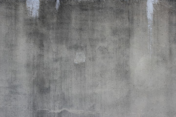 Obraz premium Weathered concrete wall with white paint stains background texture