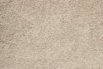 Light yellow rough weathered grain plaster wall background texture
