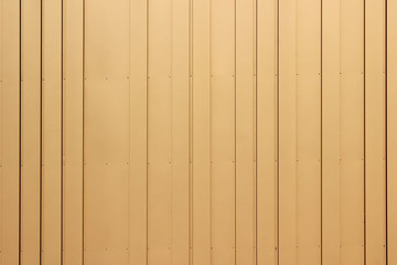 Metal aluminium yellow corrugated stripe sheet wall background with texture vertical lines