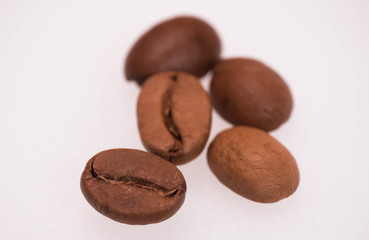 macro photo of five coffee beans