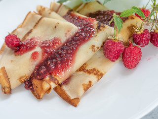 Homemade pancakes with raspberry jam. Copy space.