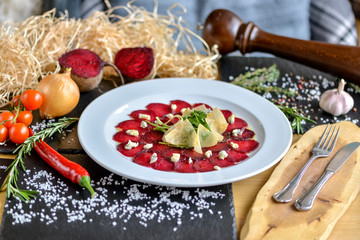 beetroot carpaccio on a white plate