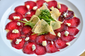 beetroot carpaccio on a white plate