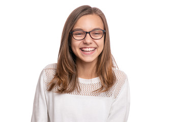Beautiful caucasian teen girl with eyeglasses, isolated on white background. Schoolgirl laughing and looking at camera. Happy smiling child - emotional portrait close-up. - 282244139