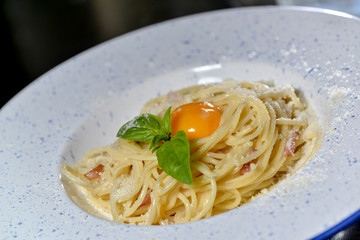 carbonara paste on a round plate with food styling