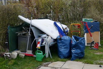 Garbage, rubble and scrap left behind in a campsite. Ready for evacuation by garbage disposal.