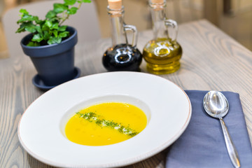 yellow cream soup in a round plate