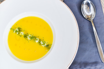yellow cream soup in a round plate