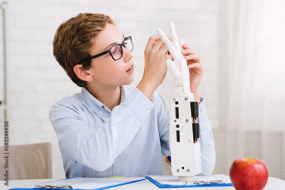 Poster smart whizzkid experimenting with humanoid robotic hand