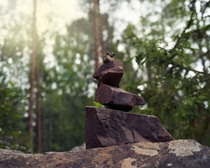 Pyramid of stones, a symbol of the wild Northern nature of Karelia. Coniferous forest
