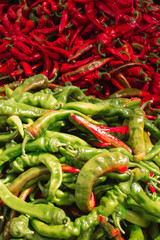 red and green peppers on a local market counter