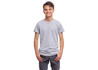 T-shirt design concept. Teen boy in blank gray t-shirt, isolated on white background. Mock up template for print. Happy child looking at camera, front view. - 282248116