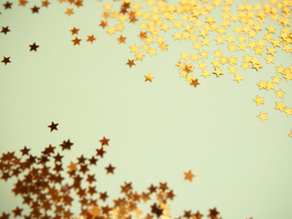 Golden stars glitter on blue background