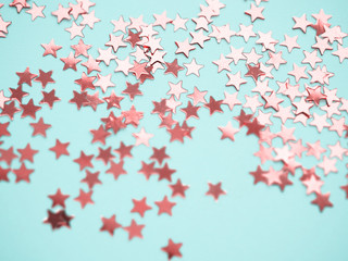 Golden stars glitter on blue background