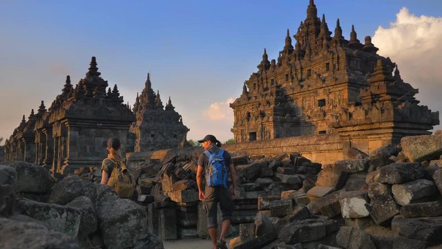 Man and woman backpackers exploring the Plaosan temple in Java island,Indonesia