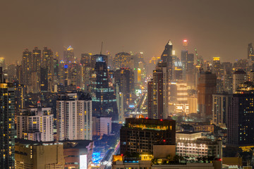 Aerial view of central business district,  commercial and residential area at night of Bangkok, Thailand