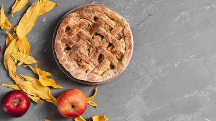 Top view of pie with apples and leaves