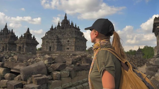 Tourist woman backpacker exploring the Prambanan temple in Java island,Indonesia