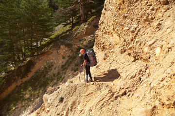 Obraz premium hiker in the mountains. climber with backpack