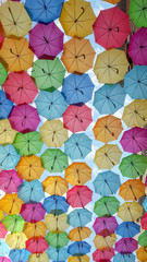 Fototapeta na wymiar Lots of colorful umbrellas in the sky city decoration background in sky