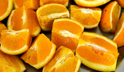 Fototapeta na wymiar Greek oranges sliced on a table.