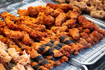 Deep fried shrimps and crispy chicken skin, Thai street food at flea market