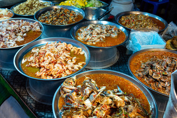 Different thai street food on sale at one of the markets at Bangkok, Thailand.