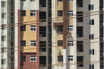 Workers painting the newly built apartment