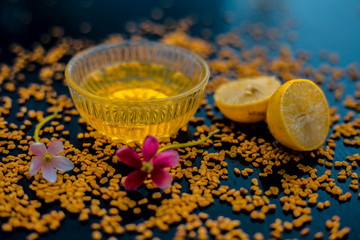 Famous natural method for dandruff on wooden surface in a glass bowl consisting of fenugreek seeds...