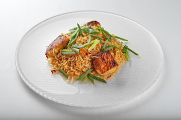 Pilaf with salmon on a white plate