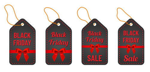 black friday sale red letterings with yellow thread and red ribbon and bow on trendy black tags. black friday commercial illustartion for seasonal promotions and advertising in stores
