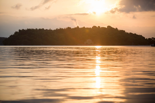 Sunset over beautiful house in Madouri, Lefkada, Greece.