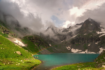 Alpine lake Klukhor with beautiful water and surrounded by mountains in the Caucasus in the Karachay-Cherkess Republic