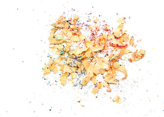 Shavings from multicolored pencils on white
