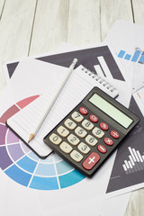 High Angle View Calculator On Documents On Table