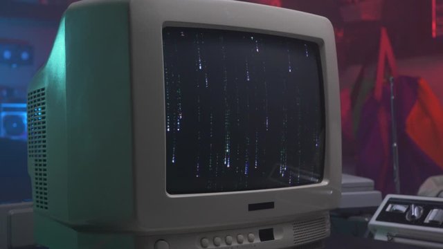 Hacking screen on a retro old computer monitor or TV from the 90s 80s