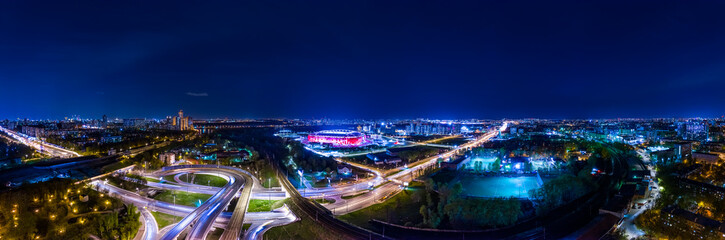 Fototapeta na wymiar Night Aerial view panorama of a freeway intersection traffic trails in night Moscow