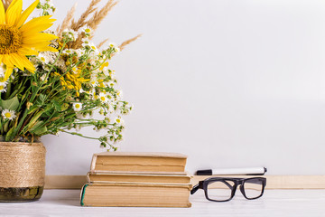 Teacher's day holiday greeting icon. Education knowledge concept. Wooden chalk board frame and vase bouquet on table empty copy space.
