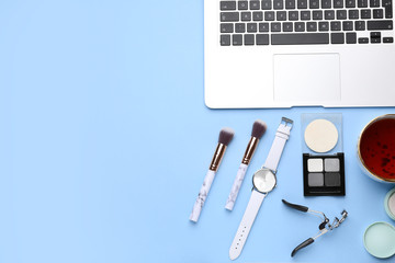 Workplace of beauty blogger on color background