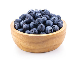 Blueberries in wood bowl  isolated on white background. full depth of field