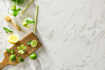 Composition with fresh mojito and ingredients on table