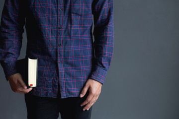 Young man holding the Holy Bible.Book, Reading, Bible.copy space