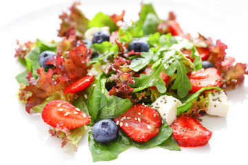 Fresh tasty salad on plate, closeup