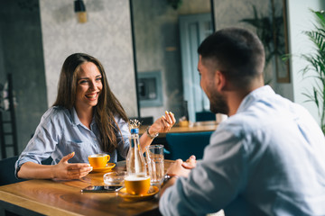 friends having a great time together in cafeteria