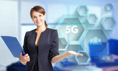 The concept of business, technology, the Internet and the network. A young entrepreneur working on a virtual screen of the future and sees the inscription: 5G