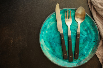 cutlery rustic, used for eating or serving (fork, knife, spoon, plate - set). food background. copy...