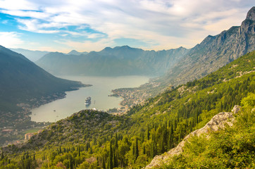 Obraz premium Kotor in a beautiful summer day. Tourist liners on the pier. Montenegro. Bay of Kotor (Gulf of Kotor, Boka Kotorska)