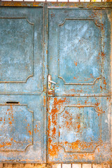 Blue metal doors. Old vintage style. Rusty texture.